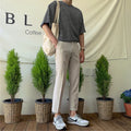 Men's Korean-style cotton straight-leg pants with drawstring waist in black, grey, or khaki