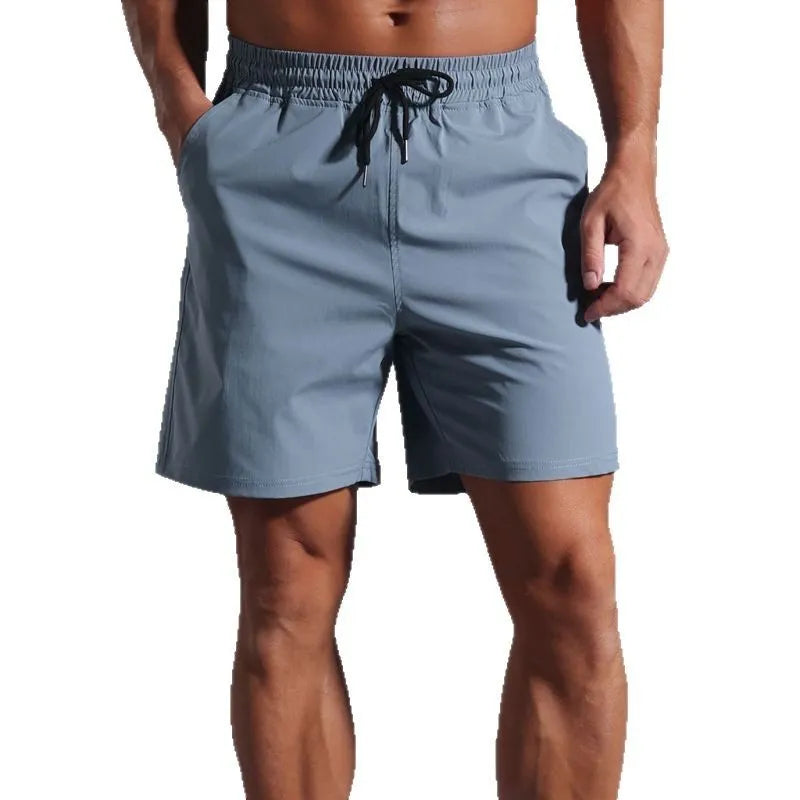 Men's loose fit quick-dry shorts in polyester available in four colours and six sizes