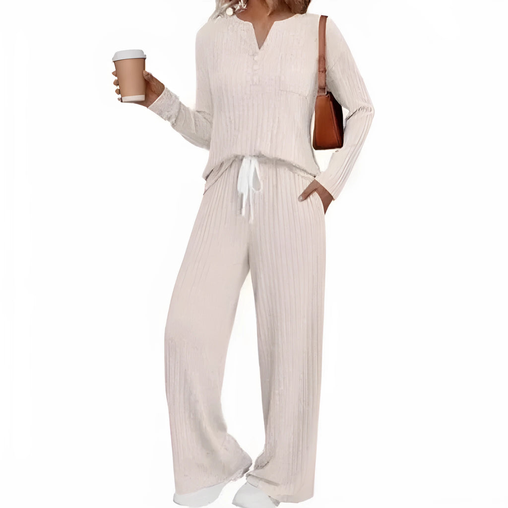 Women's light grey striped knitted long coat with v-neck, long sleeves, and lace-up detail on a mannequin.