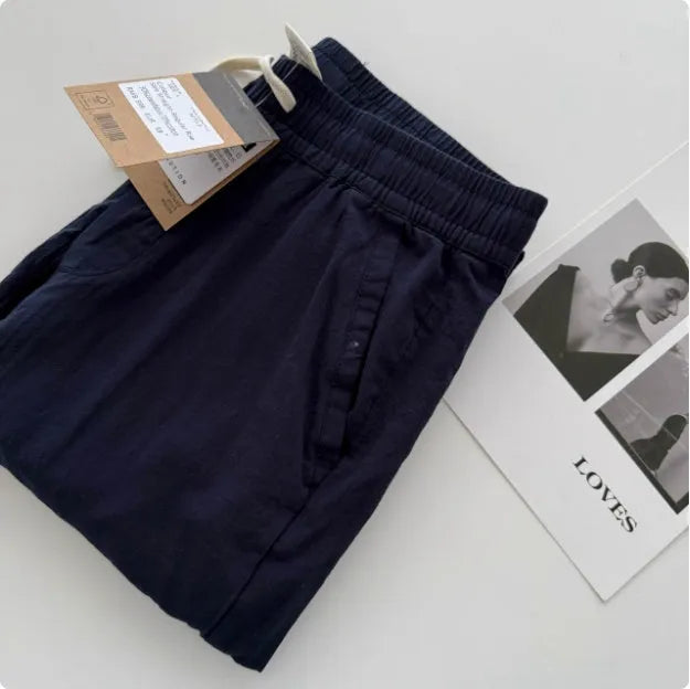 Men's loose straight-leg casual trousers with a drawstring waistband in beige.