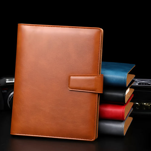 A5 hardcover PU binder notebook with metal buckle clip, shown in multiple colours.