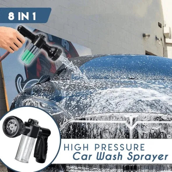 Green high-pressure foam spray gun with adjustable nozzle and connected water hose for car and garden cleaning.