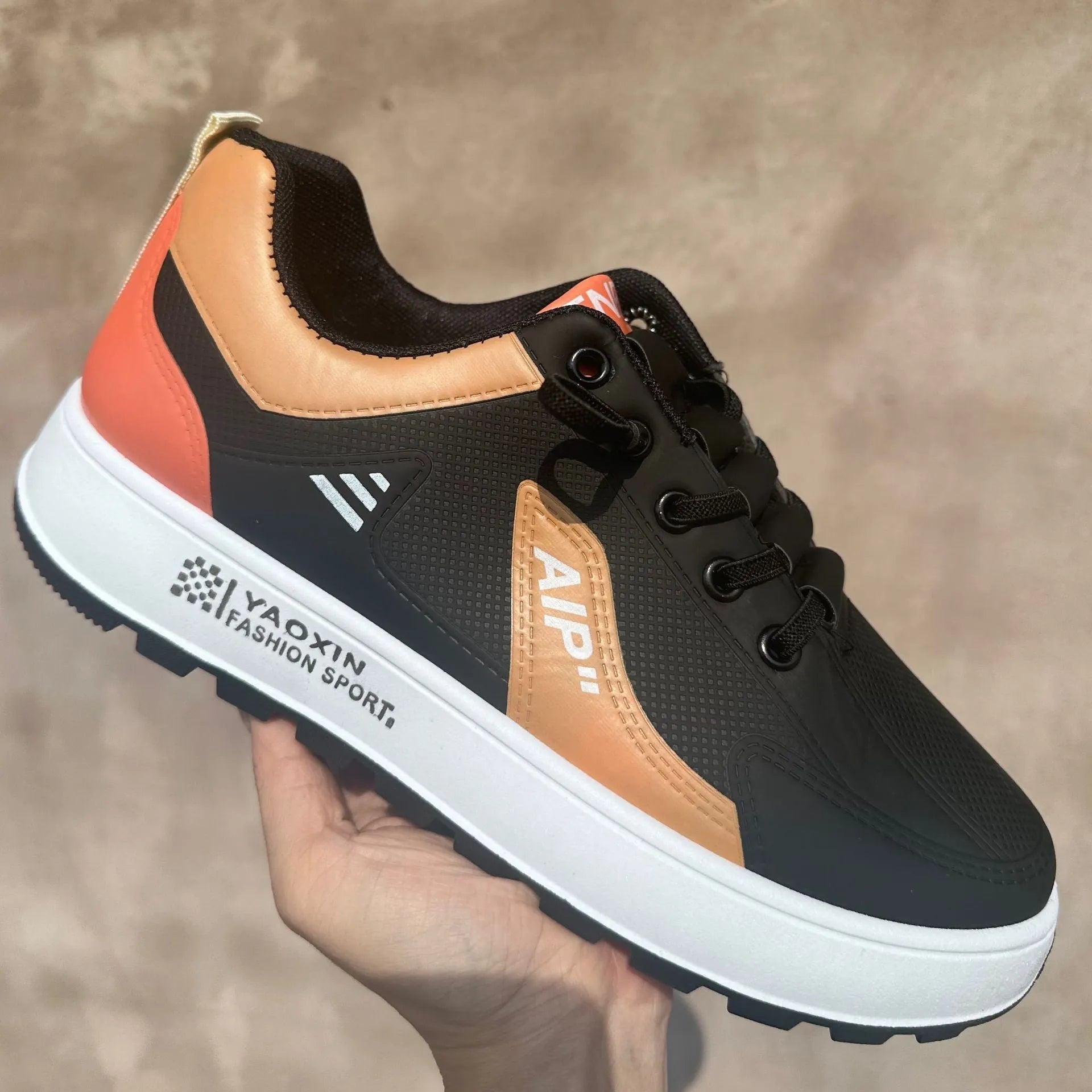 Men's white casual shoes with orange trim, round toe design and artificial PU leather upper