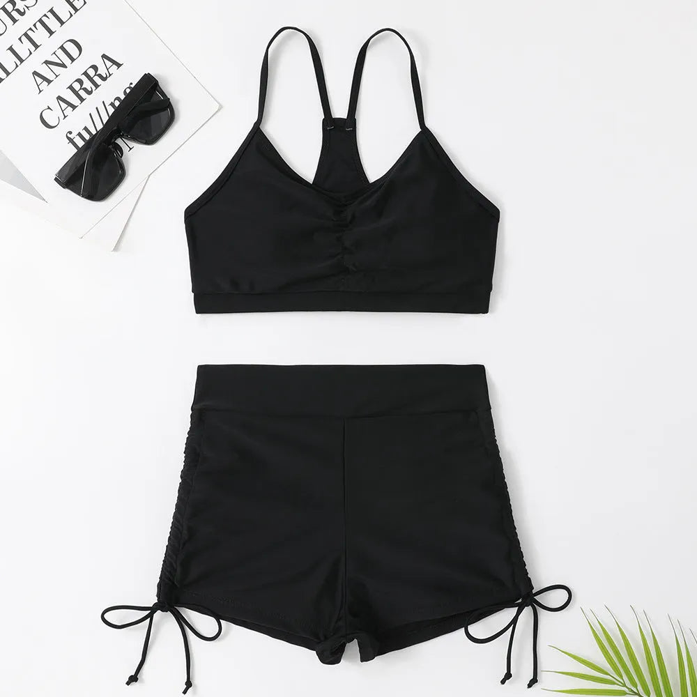 Women's black high waist split bikini swimsuit with spandex lining.