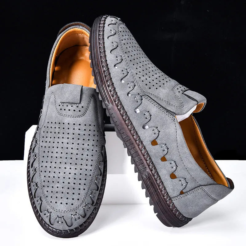 Men's brown slip-on casual leather shoes with a round toe and flat sole.