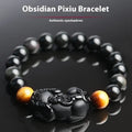 Mexico gold sheen obsidian crystal Pi Xiu bracelet with black adjustable cord, showing bead detail