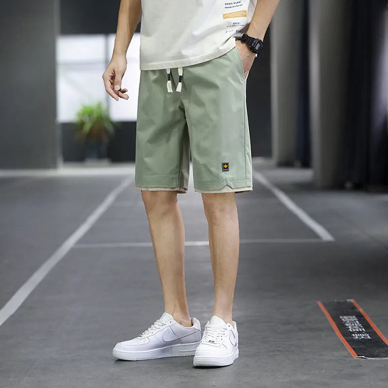 Korean style men's casual beach shorts in loose straight fit with elastic waistband