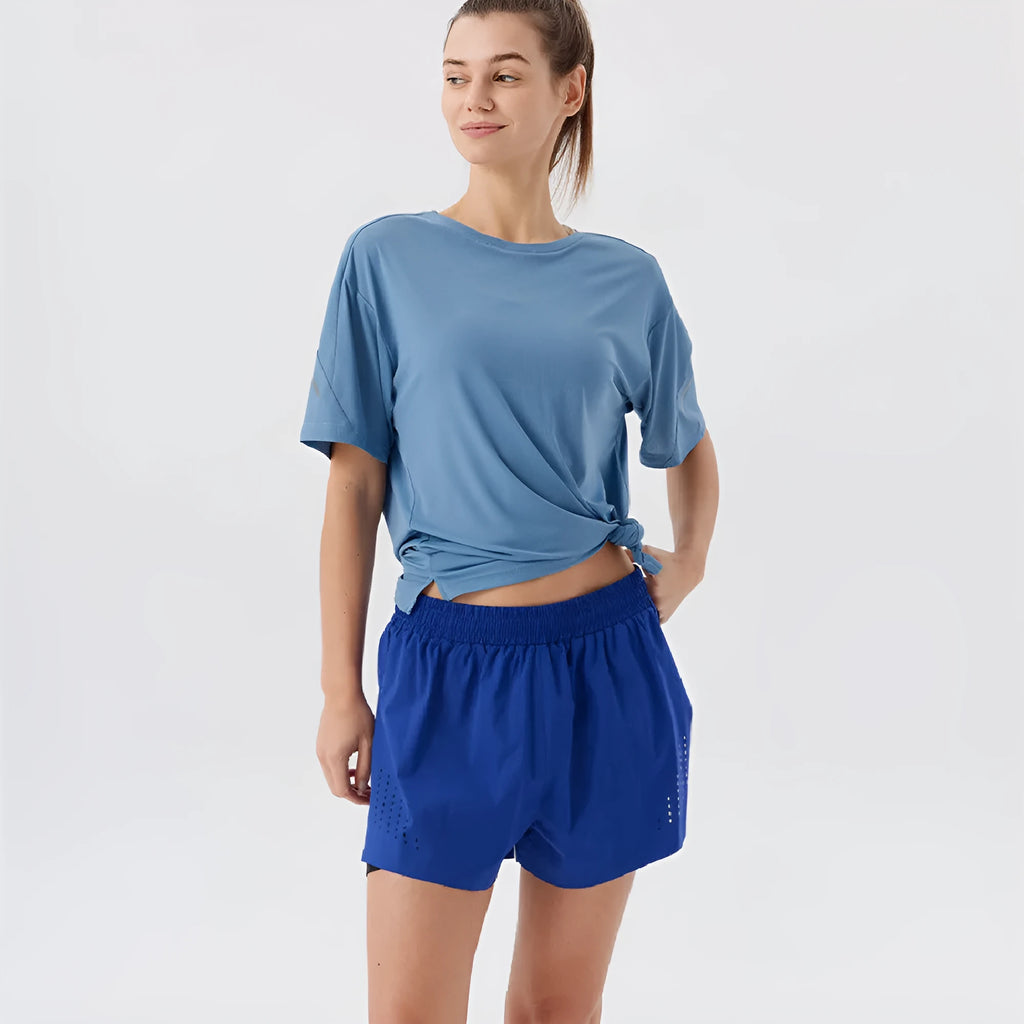 Men's straight-leg nylon sports shorts with side slits in turmeric yellow, night blue, and black.