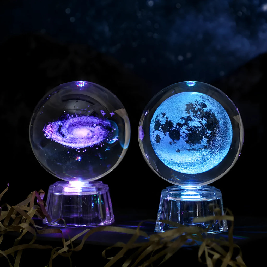 Transparent white luminous crystal ball ornament with inner carving on a fixed base for tabletop decor.