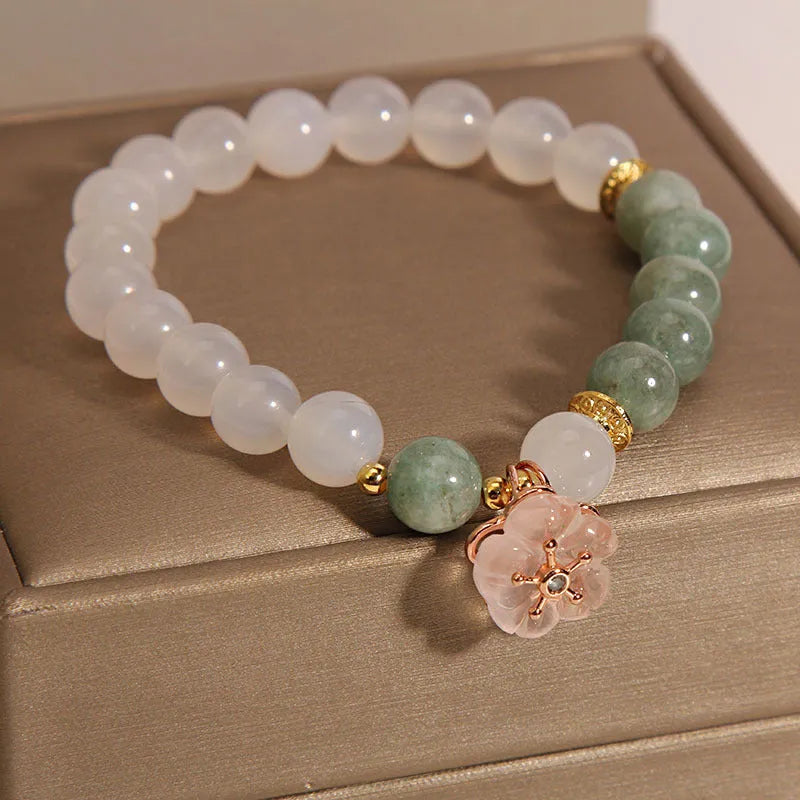 White agate and jade flower bracelet with pink accents on adjustable band