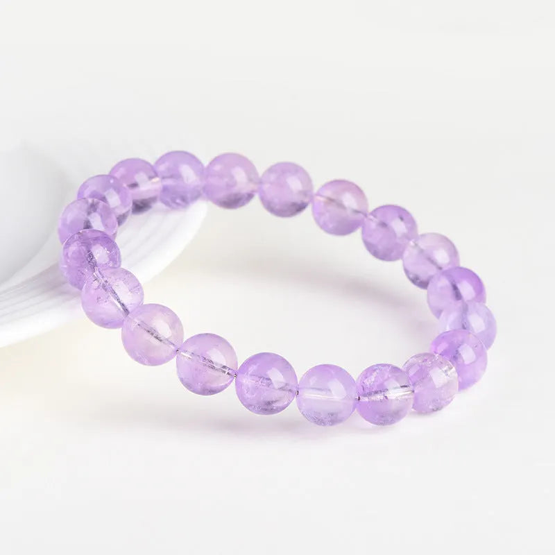 Lavender amethyst crystal bracelet with water ripple design and round beads in light purple colour