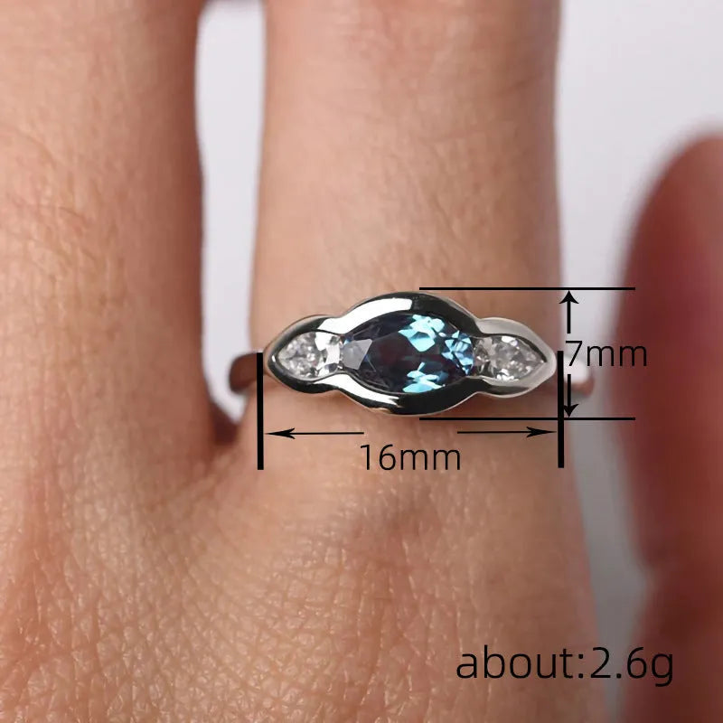 Geometric ellipse ring with zircon stones in white gold finish showing elliptical shape