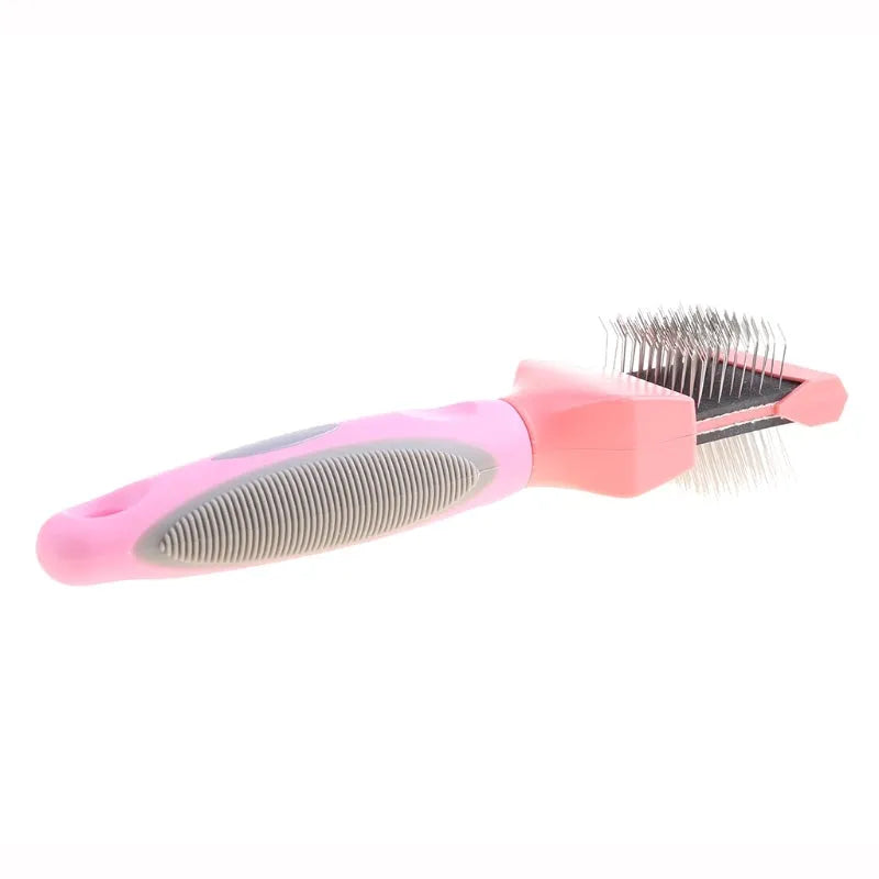 Blue and pink double-sided pet brush with stainless steel pins and ergonomic handle.