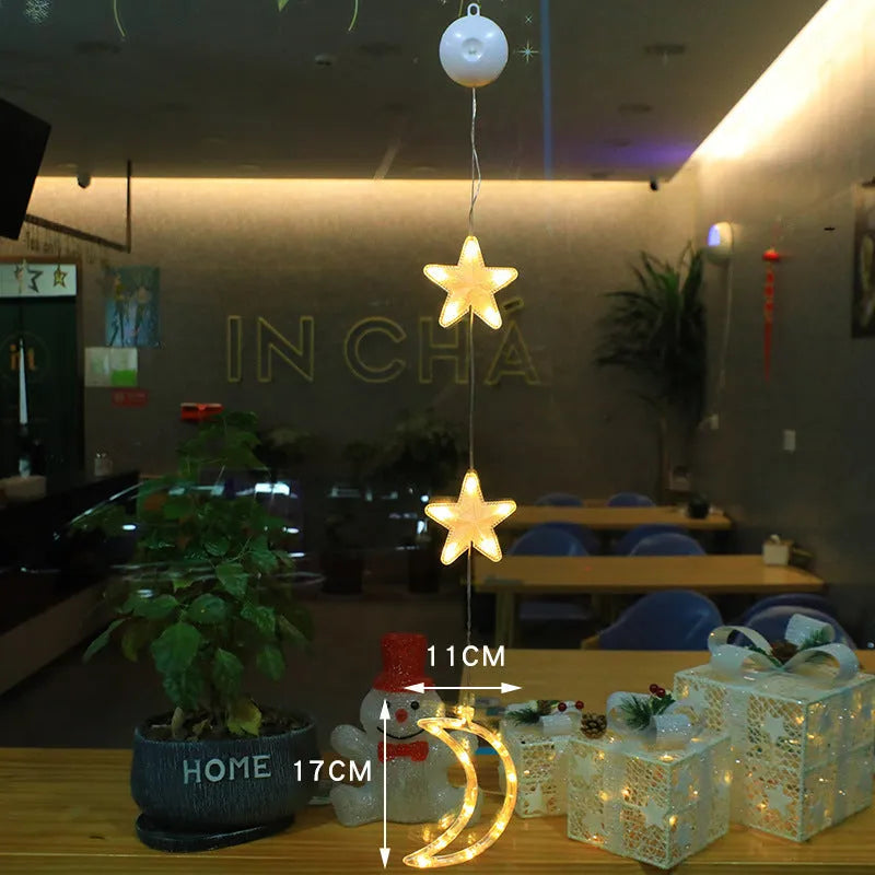 Set of three battery-powered LED Christmas pendant lights with suction cups, showing star, tree, and deer designs.