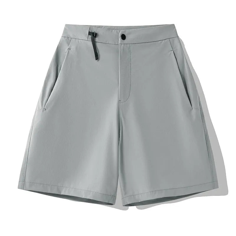 Man wearing army green quick-dry sports shorts with an elastic waistband for running or climbing.