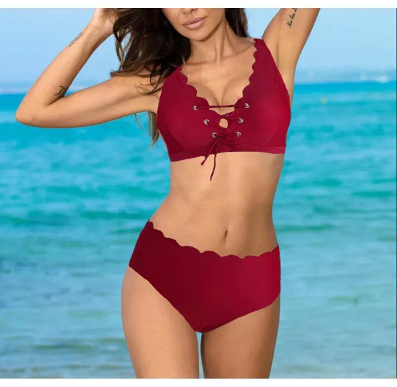 Women's high-waisted split swimsuit in polyester fabric available in red, black and blue colours