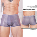 Men's thin striped nylon underwear in black, dark grey and white colours laid flat.