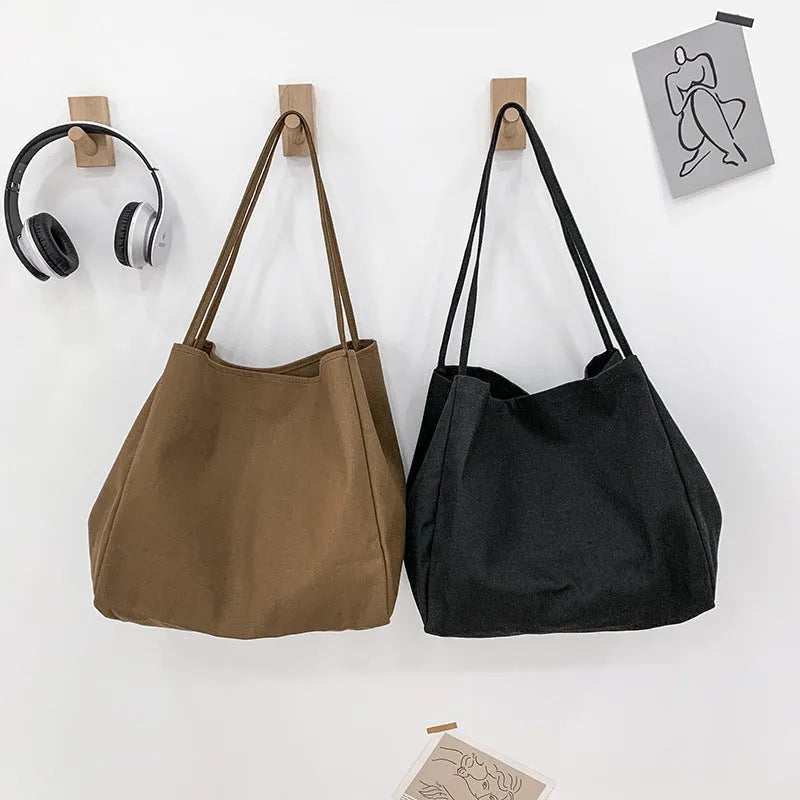 Solid colour women's canvas handbag with double shoulder straps and sandwich pocket design