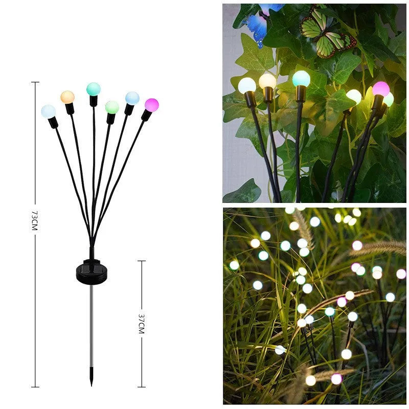 Solar-powered LED garden light with multiple heads on a stainless steel stake, placed in soil.
