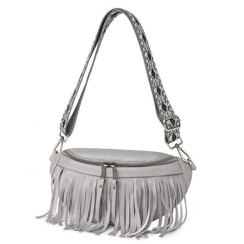European retro messenger bag with tassel pleating in macaron grey colour showing organisational compartments