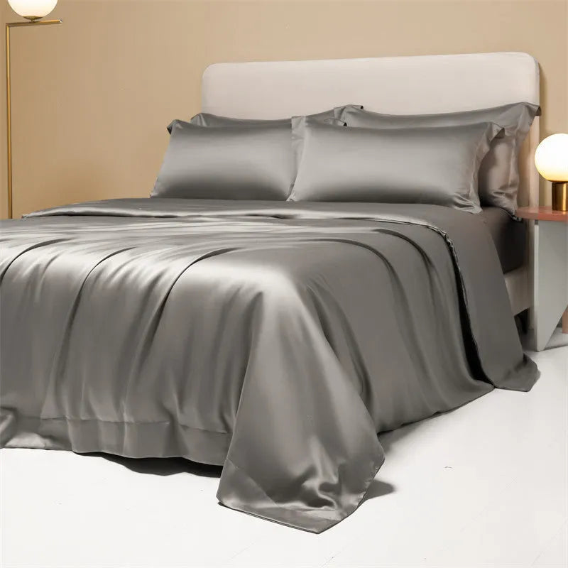200 thread count Lenzing Tencel quilt cover and sheet set in Aurora Blue, laid on a bed.