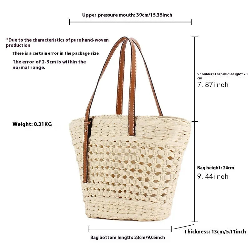 Beige paper-string woven shoulder bag with adjustable strap showing horizontal square design and straw elements