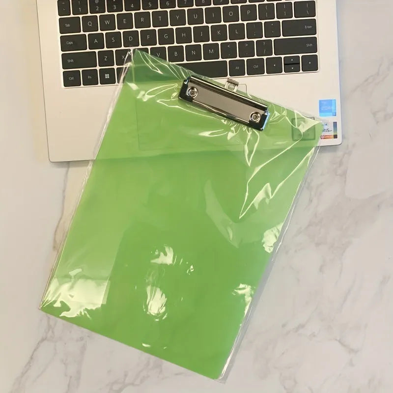 A4 transparent polypropylene clipboard with metal clip, shown in blue, holding paper.
