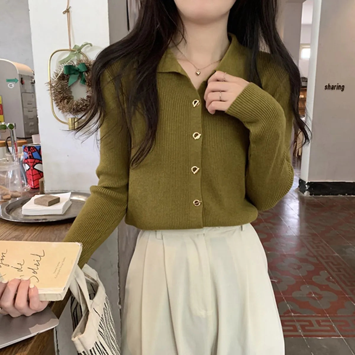 Long-sleeved loose-fitting viscose cardigan top in beige, shown worn open over a top