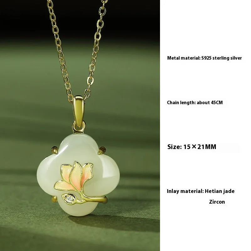 Magnolia flower jewellery set in sterling silver with inlaid green jade, showing necklace, bracelet, and stud earrings.