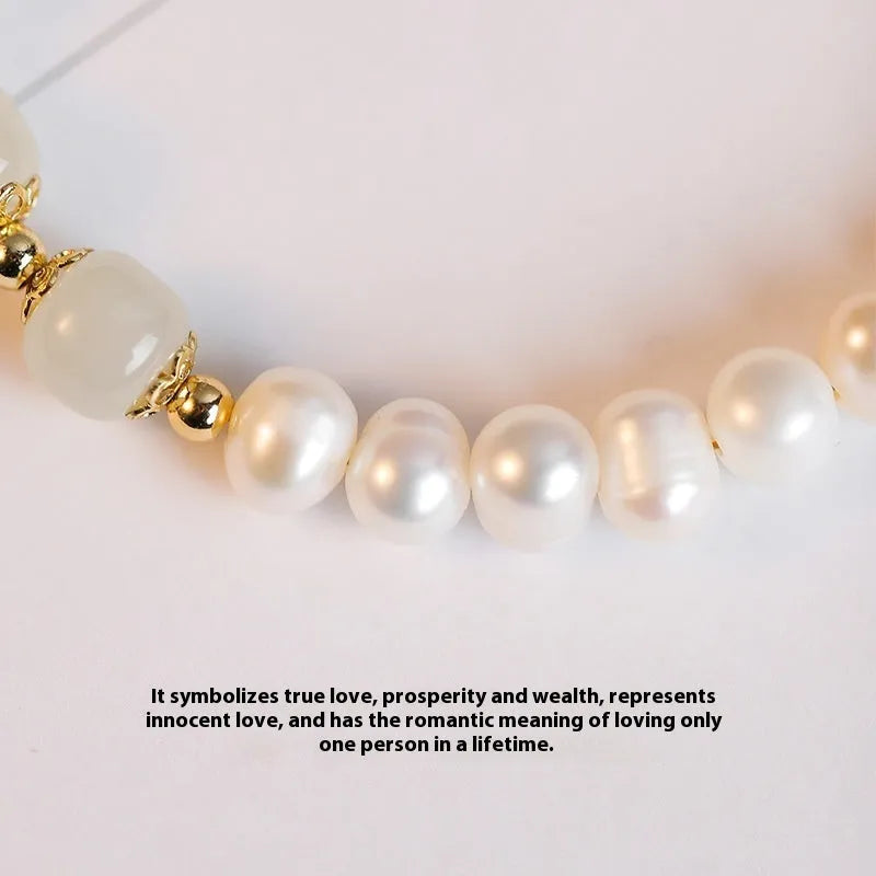 Natural freshwater pearl bracelet with diamond-shaped beads in Hetian jade colours on wrist