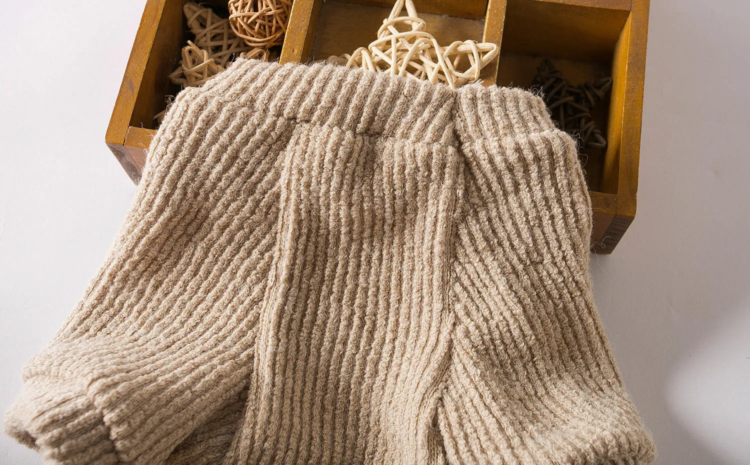 Brown cloth sweater pullover on a small dog, suitable for Bichon or Pomeranian breeds.