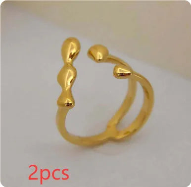 Brass spherical ring with circular design elements in gold or silver finish