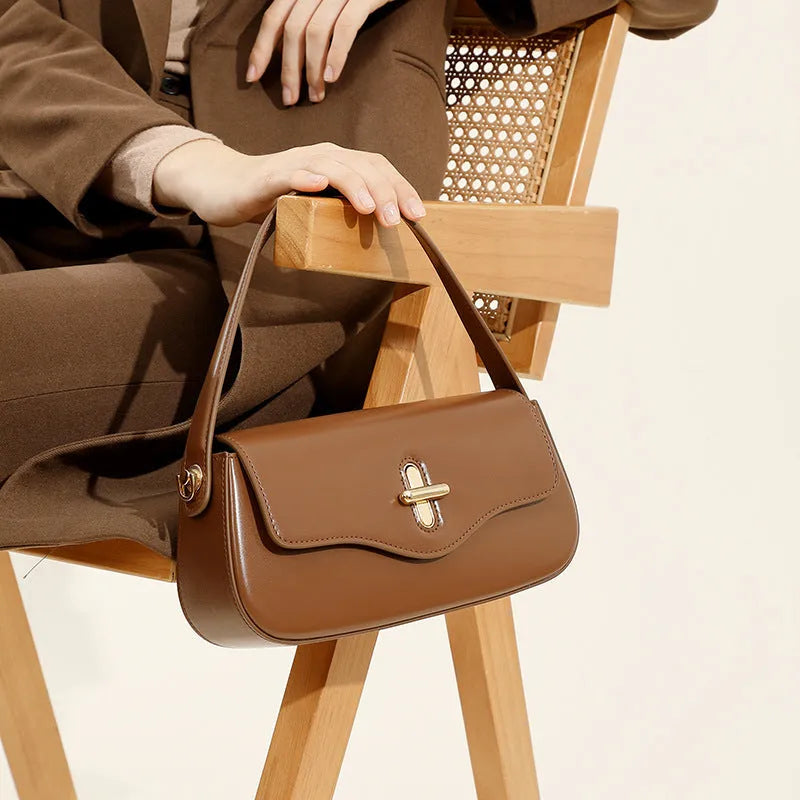 26cm wide genuine leather women's handbag in horizontal square shape with clamshell opening and double shoulder straps
