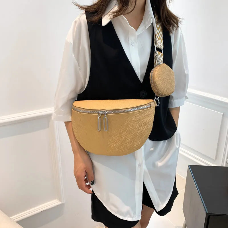 Women's solid colour textured PU crossbody bag with saddle lock hardware and clamshell opening