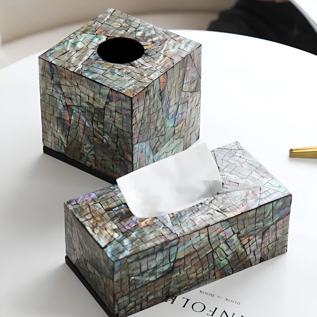 Natural shell decorative storage box tissue holder in square and rectangular shapes on a table.