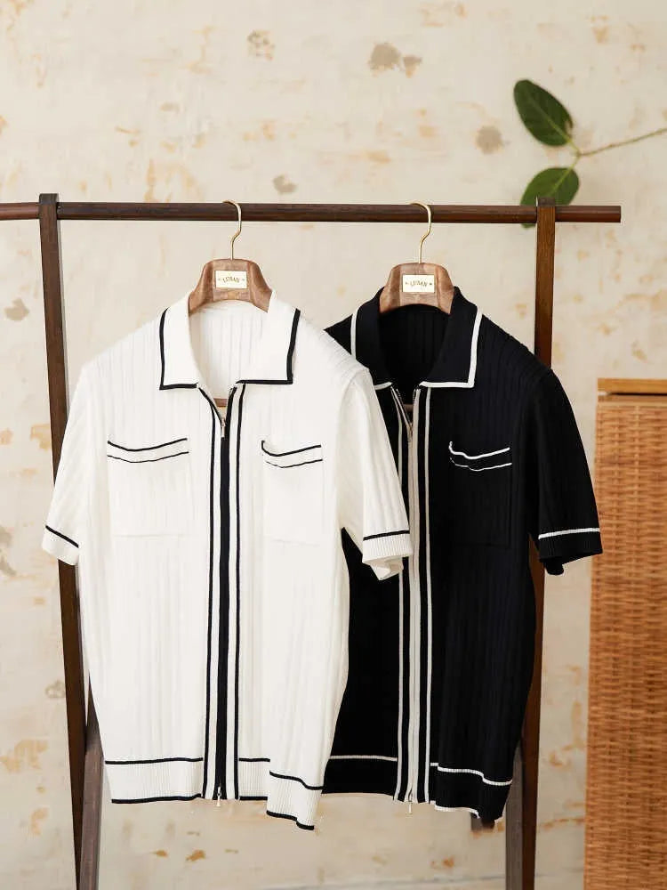 A black lapel short-sleeved knit polo shirt laid flat, showing the collar and slim fit.