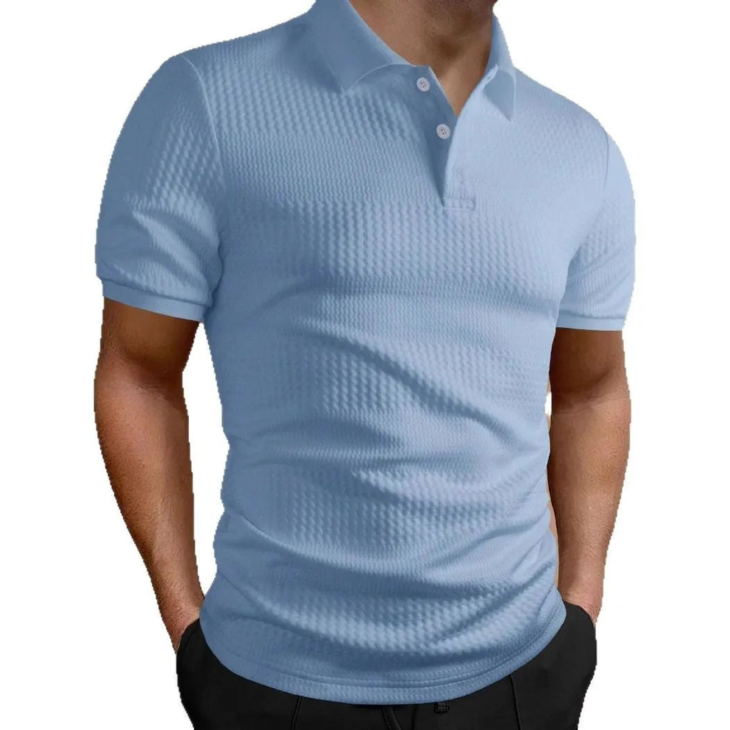 Man wearing a striped loose-fit polo shirt in a light blue colour, suitable for business casual summer wear.