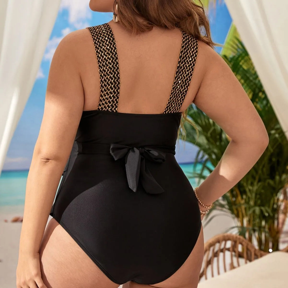 Women's plus size black one-piece swimsuit with chest pad and sleeveless design.