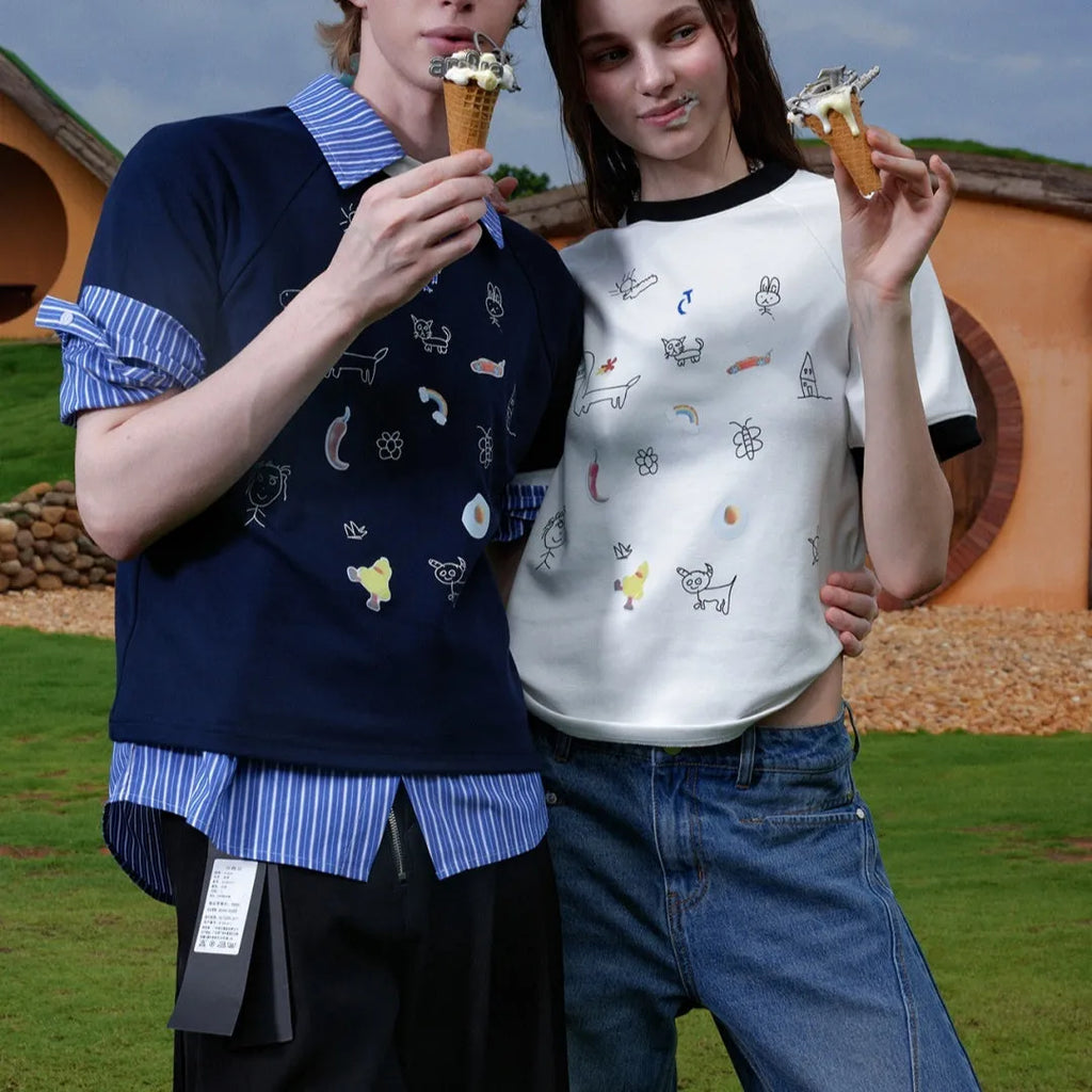 Man wearing a blue short sleeve shirt with a cartoon print design and loose fit
