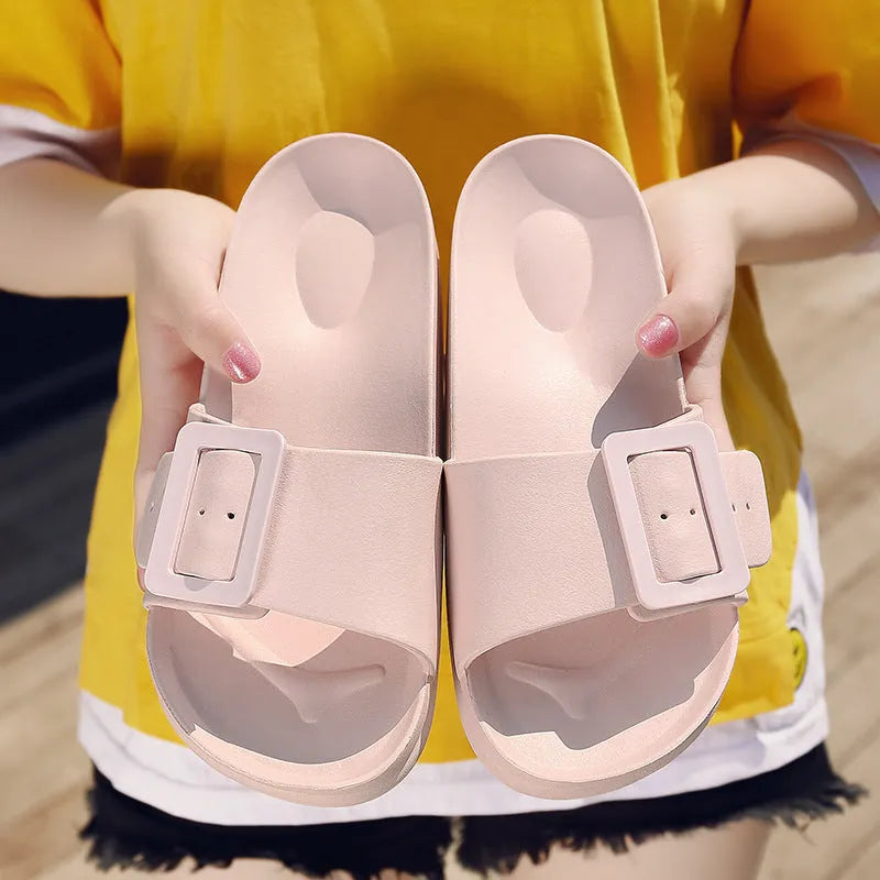 Women's grey blue flip-flop sandals with a buckle strap and soft EVA sole.