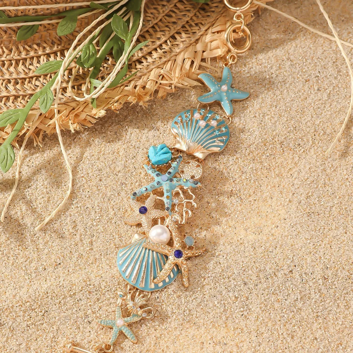 Alloy marine-themed bracelet with anchor and starfish charms in blue colour