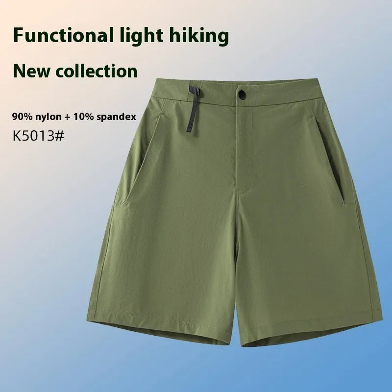 Man wearing army green quick-dry sports shorts with an elastic waistband for running or climbing.
