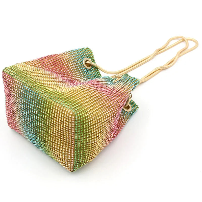 Colourful rainbow pattern rhinestone bucket bag with a soft texture.