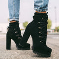 Women's army green suede Roman-style ankle boots with a thick high heel, round toe, and belt buckle detail.
