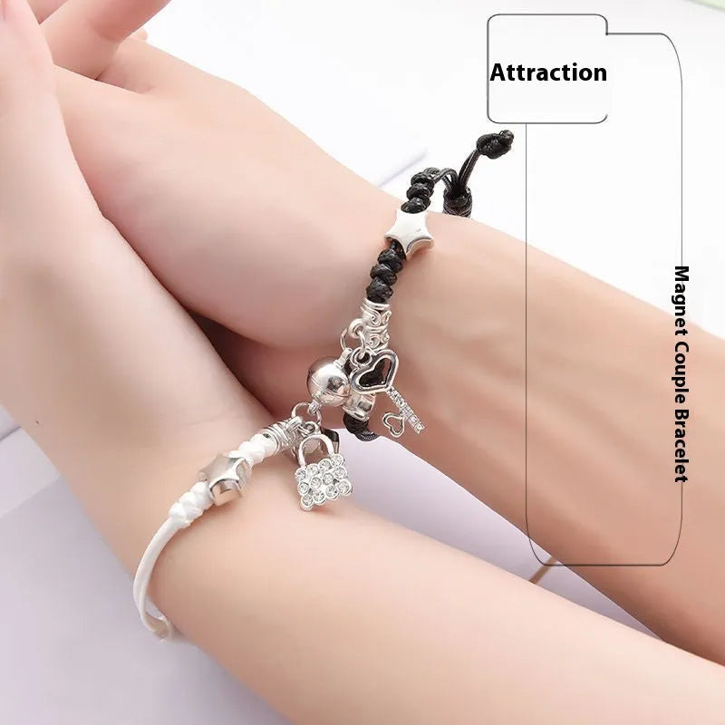 Couple suction bracelet pair showing electroplated alloy construction with crown pendant design