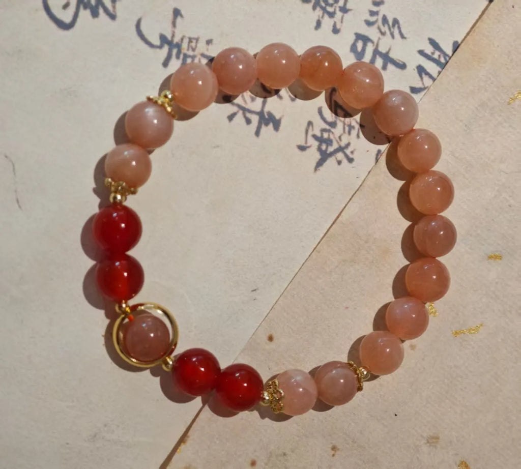 Handmade women's red agate bracelet with 8mm stones and ethnic star design featuring Xiangyun elements
