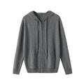 Man wearing a haze blue hooded zip-front cashmere knit cardigan in a casual setting.