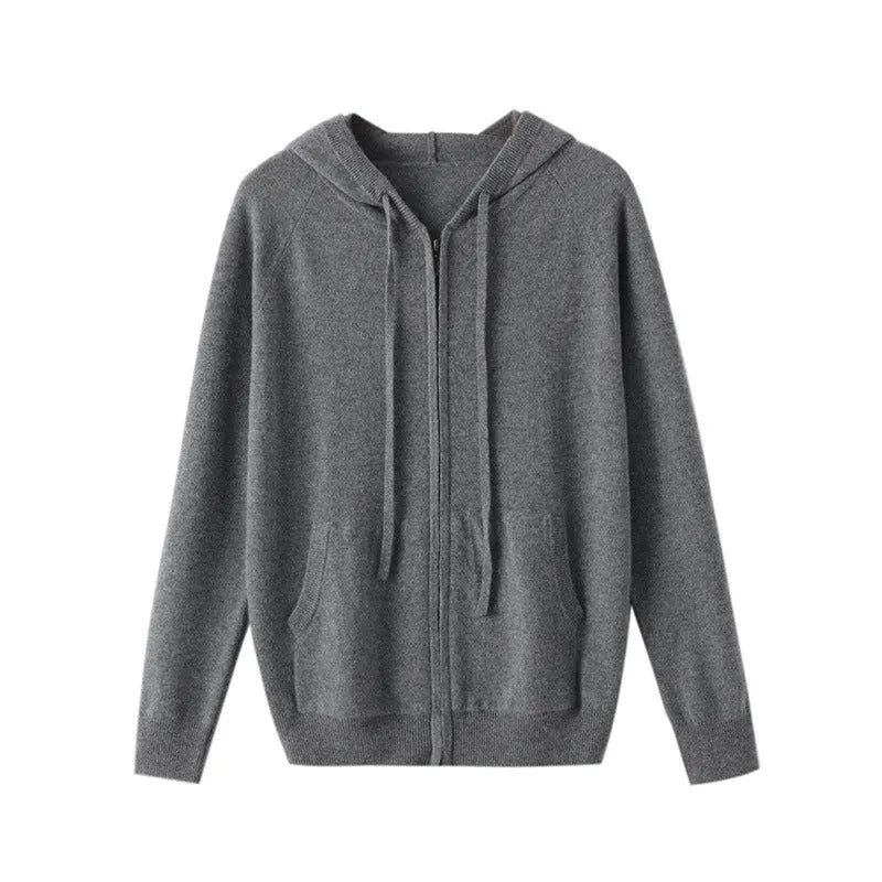 Man wearing a haze blue hooded zip-front cashmere knit cardigan in a casual setting.