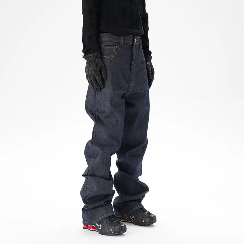 A pair of dark blue loose-fit straight leg jeans on a neutral background.