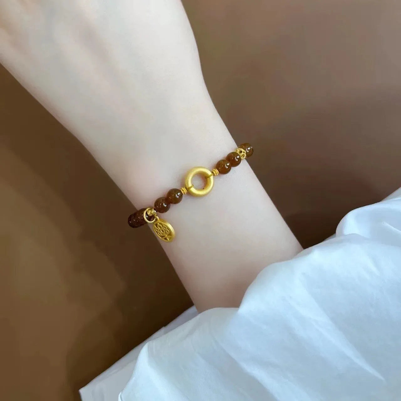 Caramel beeswax Lily bracelet with electroplated finish and floral design